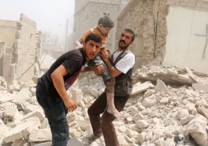 Syrians carry a wounded child in the rubble of buildings following a barrel bomb attack on the Bab al-Nairab neighbourhood of the northern Syrian city of Aleppo on August 25, 2016. / AFP PHOTO / AMEER ALHALBIAMEER ALHALBI/AFP/Getty Images