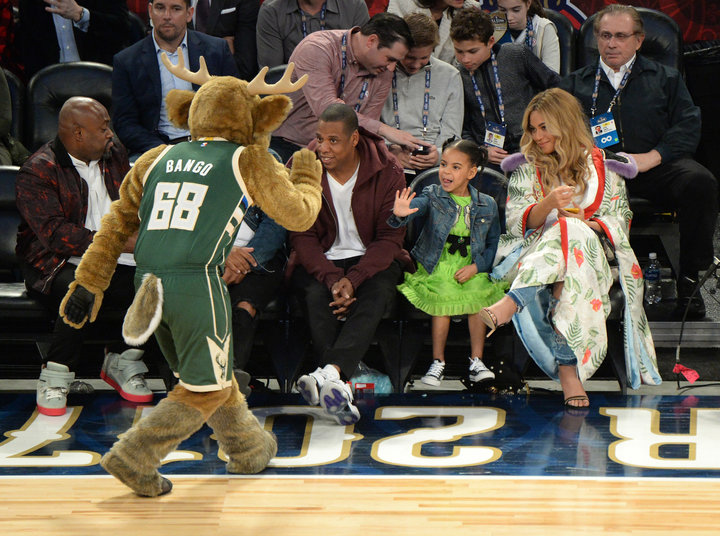 NEW ORLEANS, LA - FEBRUARY 19:  Blue Ivy Carter greets the mascot with her parents Jay Z and Beyonce Knowles at the 66th NBA All-Star Game at Smoothie King Center on February 19, 2017 in New Orleans, Louisiana.  (Photo by Kevin Mazur/Getty Images)